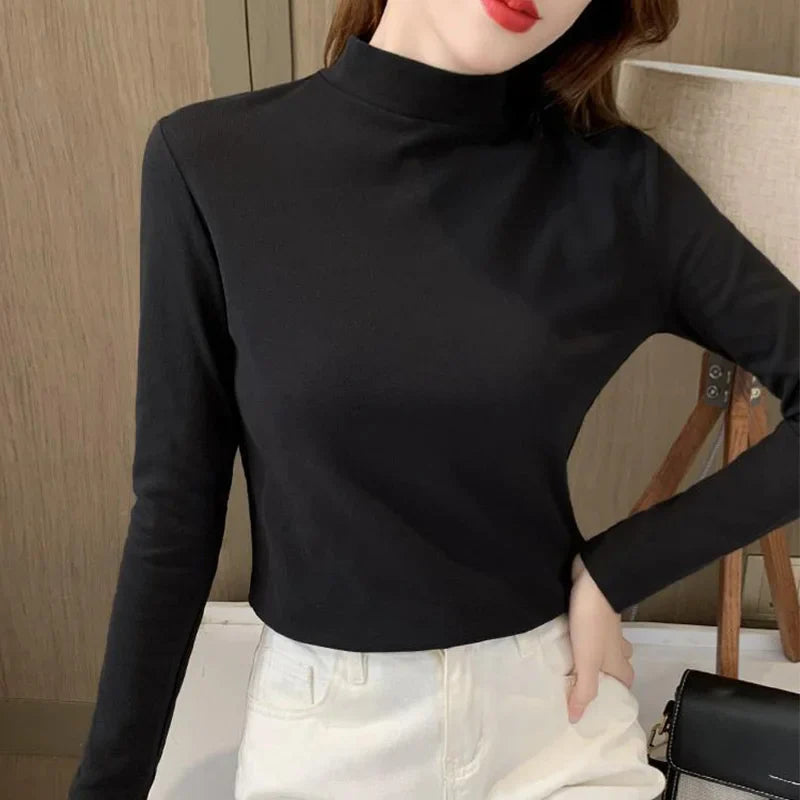 Comfortable plain top with a mid-rise neckline and long sleeves for women