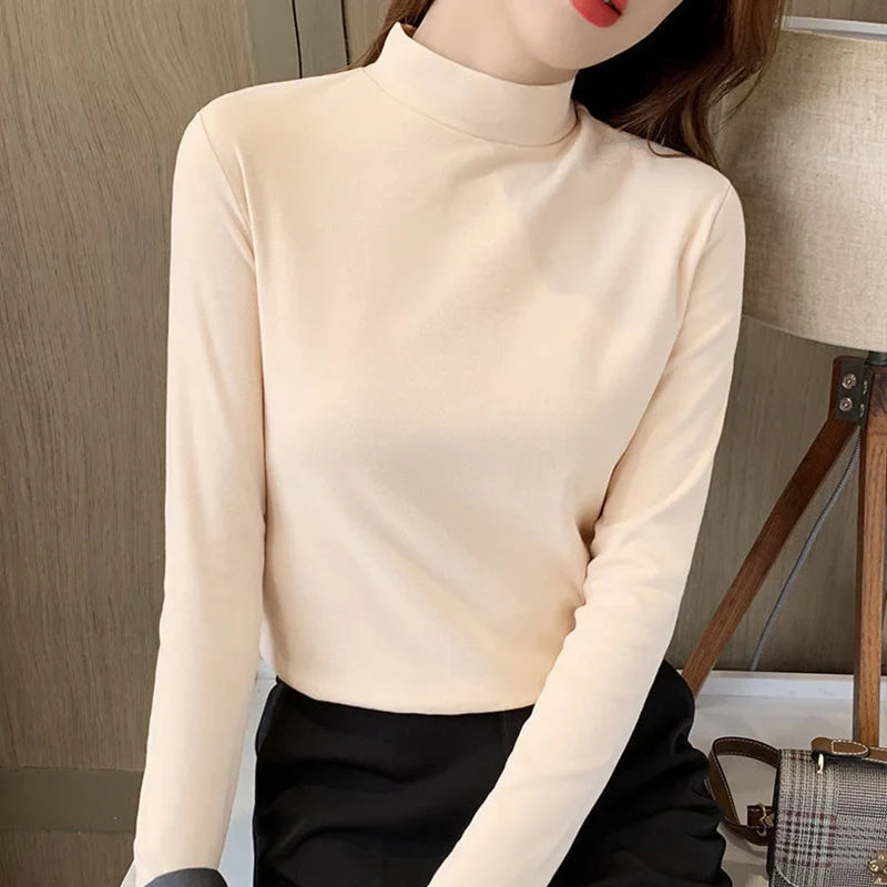 Comfortable plain top with a mid-rise neckline and long sleeves for women