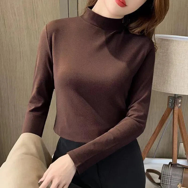 Comfortable plain top with a mid-rise neckline and long sleeves for women