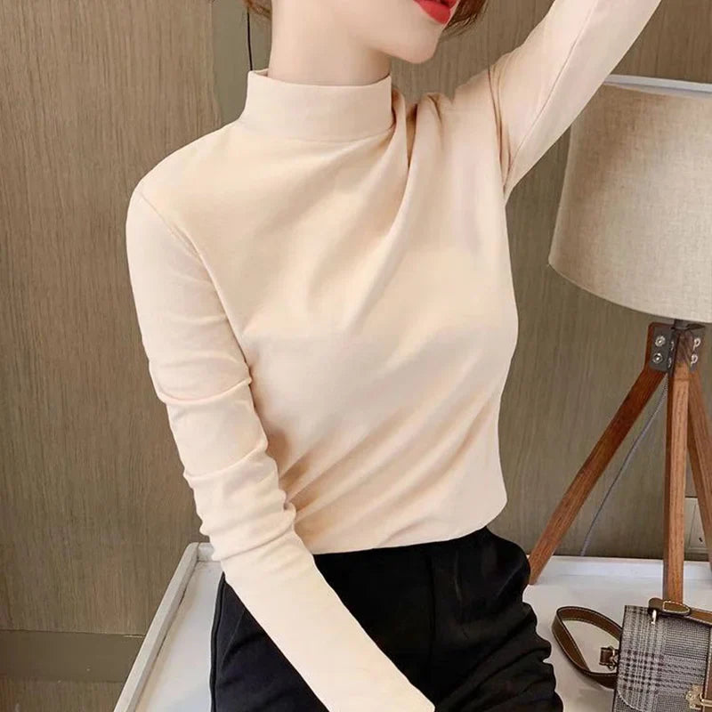 Comfortable plain top with a mid-rise neckline and long sleeves for women