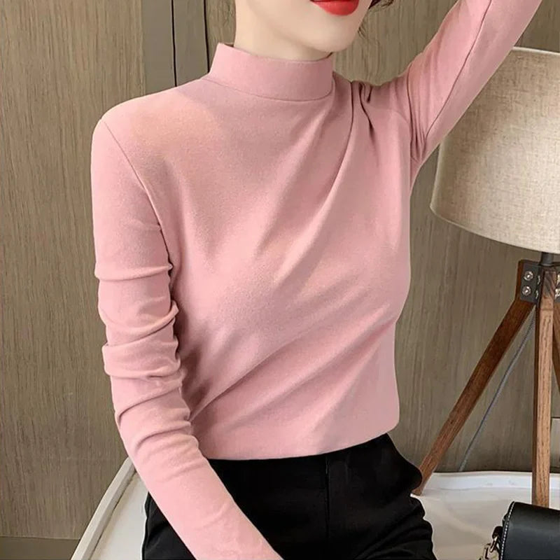 Comfortable plain top with a mid-rise neckline and long sleeves for women