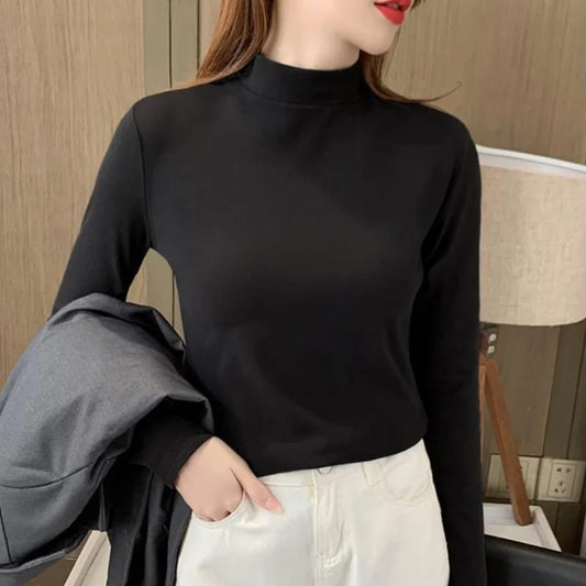 Comfortable plain top with a mid-rise neckline and long sleeves for women